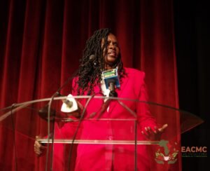 An EACMC 2025 leader delivering an address on stage